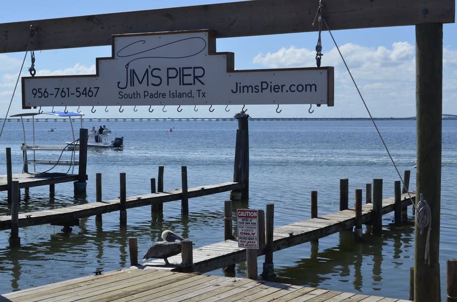 Jim's Pier sign and dock area on South Padre Island